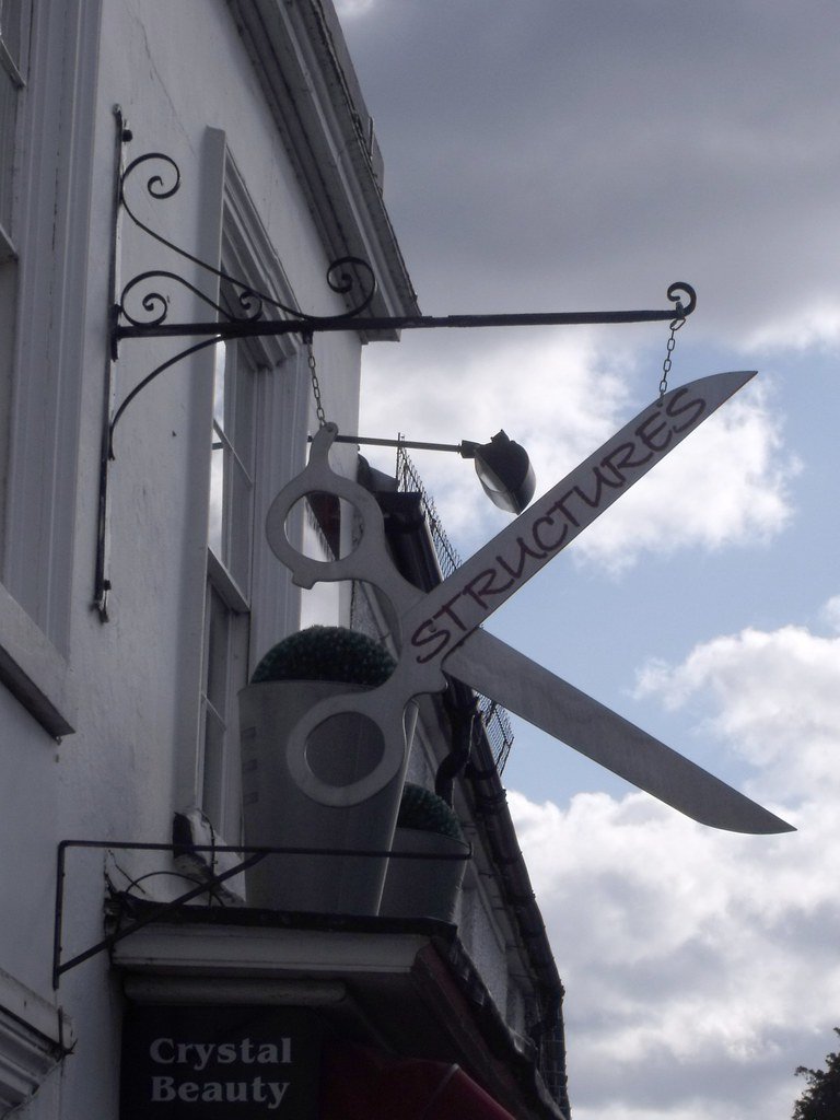 The Copper Comb storefront sign — example image